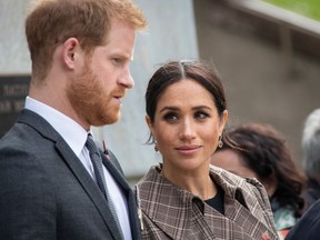 Prince Harry, Duke of Sussex and Meghan, Duchess of Sussex lay ferns and a wreath at the tomb of the Unknown Warrior at the newly unveiled UK war memorial and Pukeahu National War Memorial Park, on October 28, 2018, in Wellington, New Zealand.