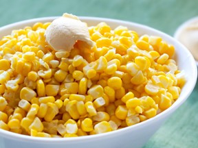 Plenty of sweet corn on a white bowl