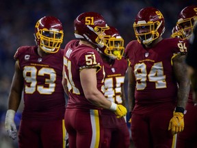 Washington Football Team outside linebacker David Mayo (51) sets the play with defensive tackles Jonathan Allen (93) and Daron Payne (94) during the game against the Dallas Cowboys at AT&T Stadium in Arlington, Texas, Sunday, Dec. 26, 2021.