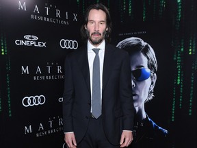 Keanu Reeves attends the Canadian Premiere of The Matrix Resurrections held at Cineplex's Scotiabank Theatre on Dec. 16, 2021.