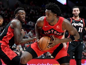 Raptors forward OG Anunoby (right) drives to the basket on Portland Trail Blazers' Nassir Little at Moda Center.