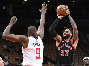Toronto Raptors guard Gary Trent Jr. (33) shoots the ball over Los Angeles Clippers centre Serge Ibaka (9) in the first half at Scotiabank Arena.