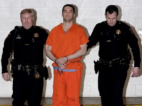 Convicted murderer Scott Peterson is escorted by San Mateo County Sheriff deputies as he is walked from the jail to an awaiting van, March 17, 2005 in Redwood City, California.