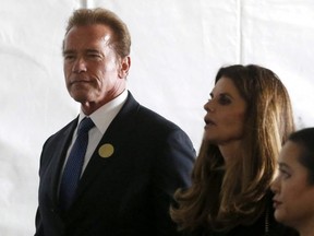 Former California Governor Arnold Schwarzenegger and Maria Shriver walk to the grave site at the funeral of Nancy Reagan at the Ronald Reagan Presidential Library in Simi Valley, Calif., March 11, 2016.