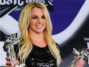 In this file photo Britney Spears holds her Best Pop Video Award and her Michael Jackson Video Vanguard Award in the press room at the 2011 MTV Video Music Awards (VMAs) August 28, 2011 at the Noika Theatre in downtown Los Angeles, California.