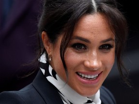 Britain's Meghan, Duchess of Sussex, reacts as she leaves after an International Women's Day panel discussion at King's College London, in London, Britain, March 8, 2019.