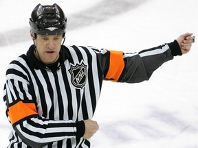 Referee Dave Jackson calls a hooking penalty during a playoff game between the New York Rangers and the New Jersey Devils on April 11, 2008, at the Prudential Center in Newark, N.J.