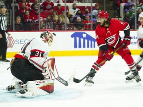 Ottawa Senators goaltender Anton Forsberg (31) stops the shot of Carolina Hurricanes defenceman Jalen Chatfield (64) during the third period at PNC Arena, Thursday.