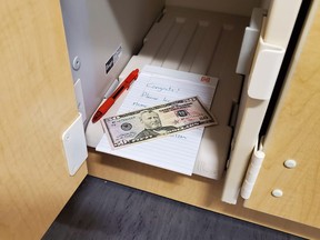 Locker with $50 bill and note inside.