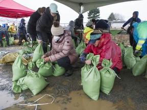 A gloomy day in Abbotsford was lightened by community spirit and a hopeful river forecast. At Albert Dyck Park, volunteers filled sandbags for anyone who needed them in the middle of another rainstorm.