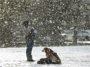 Fionia Oakes enjoys the snow with her dogs Cedar and Maxine in Vancouver, BC, February 8, 2021.
