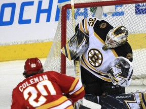Veteran Flames forward Blake Coleman directs a shot on Boston Bruins goalie Linus Ullmark during first-period NHL action at the Saddledome on Saturday night.