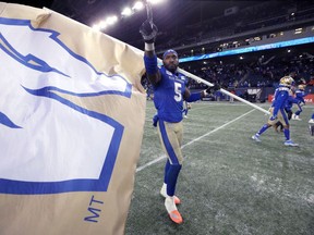 Winnipeg Blue Bombers DE Willie Jefferson celebrates on the field after beating the Saskatchewan Roughriders in the CFL West Final in Winnipeg on Sunday Dec. 5, 2021.