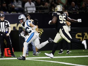 Chuba Hubbard of the Carolina Panthers scores a touchdown in the second quarter of the game against the New Orleans Saints.