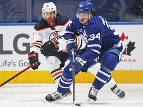 Duncan Keith (2) of the Edmonton Oilers tries to cover Auston Matthews (34) of the Toronto Maple Leafs at Scotiabank Arena on Wednesday, Jan. 5, 2022, in Toronto.