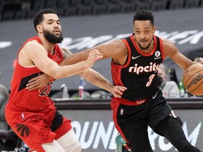 CJ McCollum #3 of the Portland Trail Blazers drives against Fred VanVleet #23 of the Toronto Raptors during the first half of their basketball game at the Scotiabank Arena on January 23.