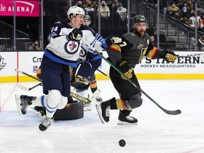 Defenceman Logan Stanley (64) is one of four Winnipeg Jets - along with defencemen Nathan Beaulieu, Ville Heinola and forward Kristian Reichel - added to Winnipeg's protocol list on Tuesday after turning up positive tests the day before.