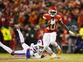 Kansas City Chiefs wide receiver Tyreek Hill carries the ball past Buffalo Bills cornerback Levi Wallace.