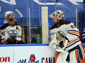 Edmonton Oilers defenceman Darnell Nurse (25) and goaltender Mike Smith (41) prepare to face the Toronto Maple Leafs at Scotiabank Arena on Wednesday, Jan. 5, 2022.