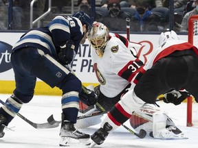 Columbus Blue Jackets centre Boone Jenner (38) moves in for the rebound against Ottawa Senators goaltender Anton Forsberg on Sunday at Nationwide Arena. Forsberg made 35 saves in his team's win.