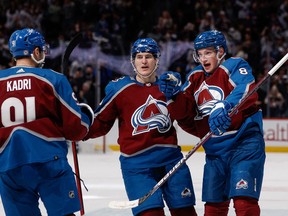 Colorado Avalanche defenceman Cale Makar (8) celebrates his goal with right wing Nicolas Aube-Kubel (16) and centre Nazem Kadri (91) in the second period against the Toronto Maple Leafs at Ball Arena.