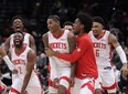 Houston Rockets' Kevin Porter Jr., front second from right in front, celebrates with his teammates after making the game-winning 3-point shot in the team's NBA basketball game against the Washington Wizards, Wednesday, Jan. 5, 2022, in Washington.