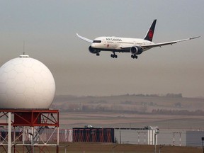 An Air Canada Boeing 787 lands at the Calgary International Airport, Oct. 5, 2021.