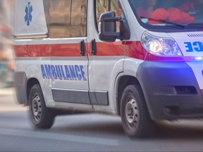 Paramedic 911 ambulance car driving fast.