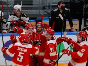 HC Kunlun Red Star players celebrate a goal against HC Avangard during a Kontinental Hockey League game in Mytishchi, Moscow region, Russia, Nov. 17, 2021.