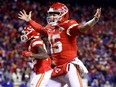 Patrick Mahomes of the Kansas City Chiefs celebrates a touchdown scored by Tyreek Hill against the Buffalo Bills during the fourth quarter in the AFC Divisional Playoff game at Arrowhead Stadium on Jan. 23, 2022 in Kansas City, Miss.