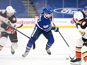 Maple Leafs' William Nylander controls the puck past Anaheim Ducks' Cam Fowler in the second period at Scotiabank Arena on Wednesday, Jan. 26, 2022.