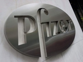 The Pfizer company logo is seen in front of Pfizer's headquarters in New York City, on April 27, 2016.