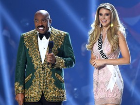 Steve Harvey interviews Miss Puerto Rico Madison Anderson onstage at the 2019 Miss Universe Pageant at Tyler Perry Studios on Dec. 8, 2019 in Atlanta, Ga.