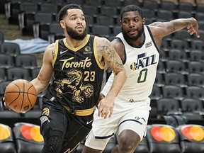 Toronto Raptors guard Fred VanVleet (left) drives to the net against Utah Jazz forward Eric Paschall during the first quarter at Scotiabank Arena on Jan. 7, 2022.