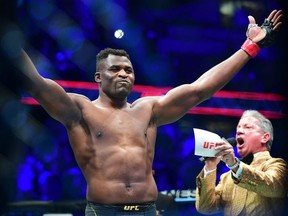 UFC 270 heavyweight world champion Cameroon's Francis Ngannou reacts on introduction for fight against France's Ciryl Gane for the heavyweight title at the Honda Center in Anaheim, California on January 22, 2022.