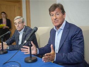 Stephen Bronfman, right, and Pierre Boivin spoke to the media in 2019 about the prospect of Major League Baseball returning to Montreal. "We all got slapped in the face," Bronfman said on Thursday after MLB nixed the plan. "We all got the same surprise together. I'm just tired and a little upset."