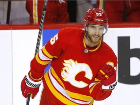Calgary Flames defenceman Noah Hanifin celebrates after scoring a goal against the Carolina Hurricanes at the Scotiabank Saddledome in Calgary on Dec. 9, 2021.