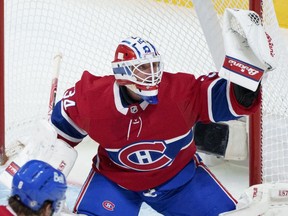 Montreal Canadiens goaltender Jake Allen snags the puck as they face the Chicago Blackhawks in Montreal on Dec. 9, 2021.