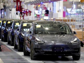 Tesla China-made Model 3 vehicles are seen during a delivery event at its factory in Shanghai, China January 7, 2020.