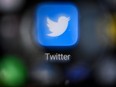In this file photo taken on Oct. 12, 2021, shows the logo of U.S. social network Twitter on a smartphone screen, in Moscow.