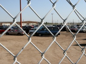 Vehicles sit in an impound lot in this file photo.