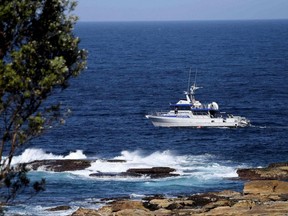 A fisheries boat patrols the site of a fatal shark attack off Little Bay Beach in Sydney, Australia, Thursday, Feb. 17, 2022.
