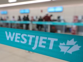 A WestJet check-in area at the Calgary International Airport is photographed on Jan. 18, 2022.