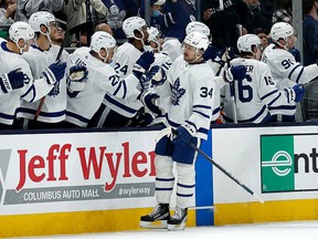 Auston Matthews of the Maple Leafs is congratulated by his teammates after scoring against the Columbus Blue Jackets at Nationwide Arena on February 22, 2022 in Columbus, Ohio.