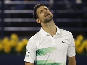 Serbia's Novak Djokovic reacts during his quarterfinal match against Czech Republic's Jiri Vesely at the Dubai Tennis Championships in Dubai, United Arab Emirates, Feb. 24, 2022.