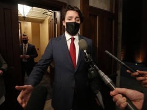 Prime Minister Justin Trudeau speaks with reporters prior to Question Period in the House of Commons on Parliament Hill in Ottawa, Feb. 8, 2022.