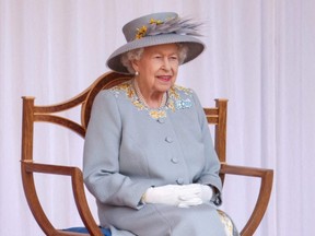 Queen Elizabeth II tested positive for COVID-19 but with "mild symptoms," according to a statement published by the royal palace on Sunday, Feb. 20, 2022.
