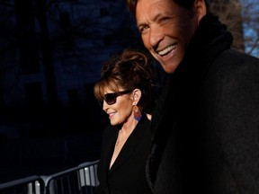 Sarah Palin arrives with former NHL player Ron Duguay during her defamation lawsuit against the New York Times, at the United States Courthouse in the Manhattan borough of New York City, Friday, Feb. 11, 2022.