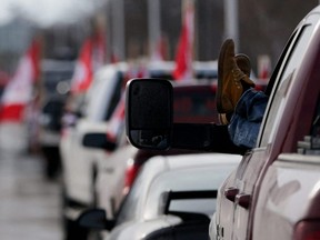 Vehicles block the route leading from the Ambassador Bridge, linking Detroit and Windsor, as truckers and their supporters continue to protest against COVID-19 vaccine mandates, in Windsor, Ont., Wednesday, Feb. 9, 2022.