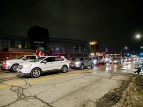 Protestors block the last entrance to the Ambassador Bridge, which connects Detroit and Windsor, effectively shutting it down as truckers and their supporters continue to protest against the COVID-19 vaccine mandates, in Windsor, Ont., Wednesday, Feb. 9, 2022.